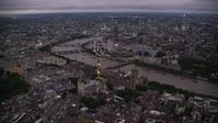 5.5K stock footage aerial video fly toward Big Ben, British Parliament, London Eye, and Westminster Abbey, London, England, night Aerial Stock Footage | AX116_141