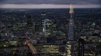 5.5K stock footage aerial video of flying by The Shard, Central London skyscrapers across River Thames, England, night Aerial Stock Footage | AX116_153