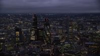 5.5K stock footage aerial video flyby Leadenhall Building, The Gherkin, Heron Tower in London, England, night Aerial Stock Footage | AX116_161