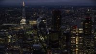 5.5K stock footage aerial video of The Gherkin seen from Heron Tower, The Shard in background, London, England, night Aerial Stock Footage | AX116_167