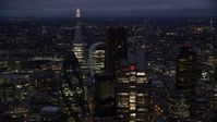 5.5K stock footage aerial video of flying by Central London skyscrapers, The Shard in background, England, night Aerial Stock Footage | AX116_168