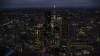5.5K stock footage aerial video orbiting Central London skyscrapers with The Shard in background, England, night Aerial Stock Footage | AX116_169