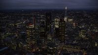 5.5K stock footage aerial video of passing by Central London skyscrapers, The Shard in background, England, night Aerial Stock Footage | AX116_170