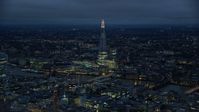 5.5K stock footage aerial video of a view of The Shard and River Thames, London, England, night Aerial Stock Footage | AX116_173
