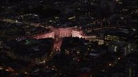 5.5K stock footage aerial video of orbiting the bright lights of Piccadilly Circus, London, England, night Aerial Stock Footage | AX116_179