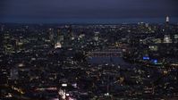 5.5K stock footage aerial video of flying by Central London cityscape around River Thames, London, England, night Aerial Stock Footage | AX116_190