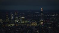 5.5K stock footage aerial video of a view of The Shard and skyscrapers in Central London, England, night Aerial Stock Footage | AX116_200