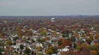 5.5K stock footage aerial video of suburban residential neighborhood in Autumn, Farmingdale, New York Aerial Stock Footage | AX117_001E