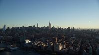 5.5K stock footage aerial video of a wide view of Midtown Manhattan skyscrapers at sunrise in New York City Aerial Stock Footage | AX118_158E