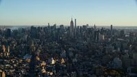 5.5K stock footage aerial video of a wide view of skyscrapers in Midtown Manhattan at sunrise in New York City Aerial Stock Footage | AX118_167