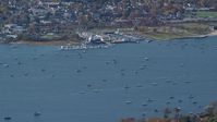5.5K stock footage aerial video of sailboats near a marina in Autumn, Oyster Bay, New York Aerial Stock Footage | AX119_241