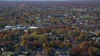 5.5K stock footage aerial video of a suburban residential neighborhood and water tower in Autumn, Farmingdale, New York Aerial Stock Footage | AX119_254