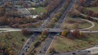 5.5K stock footage aerial video follow freeway with light traffic in Autumn, Wantagh, New York Aerial Stock Footage | AX120_013E