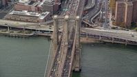 5.5K stock footage aerial video orbit heavy traffic on the Brooklyn Bridge, New York City Aerial Stock Footage | AX120_136