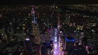 5.5K stock footage aerial video of circling over Times Square in Midtown at Night, New York City Aerial Stock Footage | AX122_117
