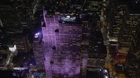 5.5K stock footage aerial video approach Rockefeller Center at Night in Midtown, New York City Aerial Stock Footage | AX122_136E