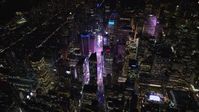 5.5K stock footage aerial video orbit and approach Times Square at Night in Midtown, New York City Aerial Stock Footage | AX122_174E
