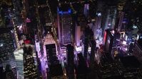 5.5K stock footage aerial video orbit skyscrapers around Times Square at Night in Midtown Manhattan, New York City Aerial Stock Footage | AX122_197E