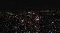 5.5K stock footage aerial video of the Empire State Building and Lower Manhattan at Night in New York City Aerial Stock Footage | AX122_211E