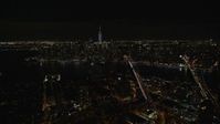 5.5K stock footage aerial video fly over Brooklyn to approach bridges over East River and Lower Manhattan at Night, NYC Aerial Stock Footage | AX122_275E