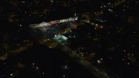 5.5K stock footage aerial video approach suburban strip mall at Night in Hempstead, New York Aerial Stock Footage | AX123_155E