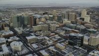 5.5K stock footage aerial video orbit of Downtown Salt Lake City with winter snow at sunrise in Utah Aerial Stock Footage | AX124_197