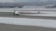 5.5K stock footage aerial video of tracking civilian jet at SLC Airport in winter at sunrise, Utah Aerial Stock Footage | AX124_235
