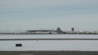 5.5K stock footage aerial video of Salt Lake City International Airport revealing commercial jet in winter, Utah Aerial Stock Footage | AX125_001