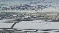 5.5K stock footage aerial video of Salt Lake City International Airport with winter snow, Utah Aerial Stock Footage | AX125_008