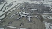 5.5K stock footage aerial video of orbiting SLC Airport terminals and parking lots with winter snow in Utah Aerial Stock Footage | AX125_016