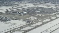 5.5K stock footage aerial video approach commercial jet racing down runway at SLC Airport in winter, Utah Aerial Stock Footage | AX125_326