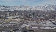 5.5K stock footage aerial video of the downtown area of Salt Lake City with winter snow in Utah Aerial Stock Footage | AX126_008