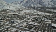 5.5K stock footage aerial video orbit office buildings in Salt Lake City with winter snow, Utah Aerial Stock Footage | AX126_060