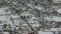 5.5K stock footage aerial video of flying over homes with snow on rooftops in winter, Midway, Utah Aerial Stock Footage | AX126_208