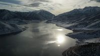 5.5K stock footage aerial video orbit sunlight reflected off Deer Creek Reservoir in wintertime, Utah Aerial Stock Footage | AX126_225