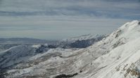 5.5K stock footage aerial video fly over steep, snow covered Mount Timpanogos slopes in Utah Aerial Stock Footage | AX126_264
