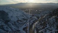 5.5K stock footage aerial video approach Salt Lake City suburbs from I-80 through Wasatch Range at sunset, Utah Aerial Stock Footage | AX127_072