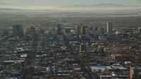 5.5K stock footage aerial video orbit buildings in Downtown Salt Lake City with winter snow at sunset in Utah Aerial Stock Footage | AX127_085