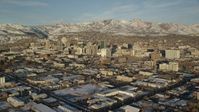 5.5K stock footage aerial video of circling Downtown Salt Lake City with winter snow at sunset, Utah Aerial Stock Footage | AX127_100