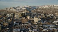 5.5K stock footage aerial video of buildings with winter snow in Downtown Salt Lake City at sunset, Utah Aerial Stock Footage | AX127_110