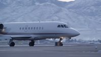 5.5K stock footage aerial video of tracking a passing private jet at SLC Airport with winter snow at sunset, Utah Aerial Stock Footage | AX128_002