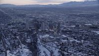5.5K stock footage aerial video orbit north side of the state capitol building and Downtown SLC with winter snow at sunset, Utah Aerial Stock Footage | AX128_015