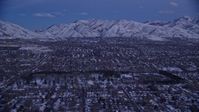 5.5K stock footage aerial video of suburban Neighborhoods and Liberty Park with winter snow at twilight, Salt Lake City, Utah Aerial Stock Footage | AX128_029