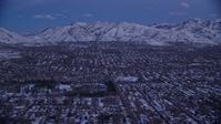 5.5K stock footage aerial video of Salt Lake City suburban neighborhoods near Liberty Park with winter snow at twilight, Utah Aerial Stock Footage | AX128_030
