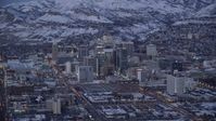 5.5K stock footage aerial video orbit Downtown Salt Lake City with winter snow seen from West Temple Street at twilight, Utah Aerial Stock Footage | AX128_039