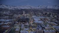 5.5K stock footage aerial video orbit arena and convention center on the west side of Downtown SLC, Utah with winter snow at twilight Aerial Stock Footage | AX128_046