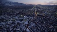 5.5K stock footage aerial video of circling north around the capitol and Downtown Salt Lake City with winter snow at twilight, Utah Aerial Stock Footage | AX128_051