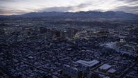 5.5K stock footage aerial video orbit Downtown Salt Lake City, Utah, and the capitol with winter snow at twilight Aerial Stock Footage | AX128_054