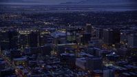 5.5K stock footage aerial video of orbiting buildings in Downtown SLC, Utah with winter snow at twilight Aerial Stock Footage | AX128_059