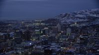 5.5K stock footage aerial video orbit southeast side of Downtown SLC and capitol with winter snow at night, Utah Aerial Stock Footage | AX128_061